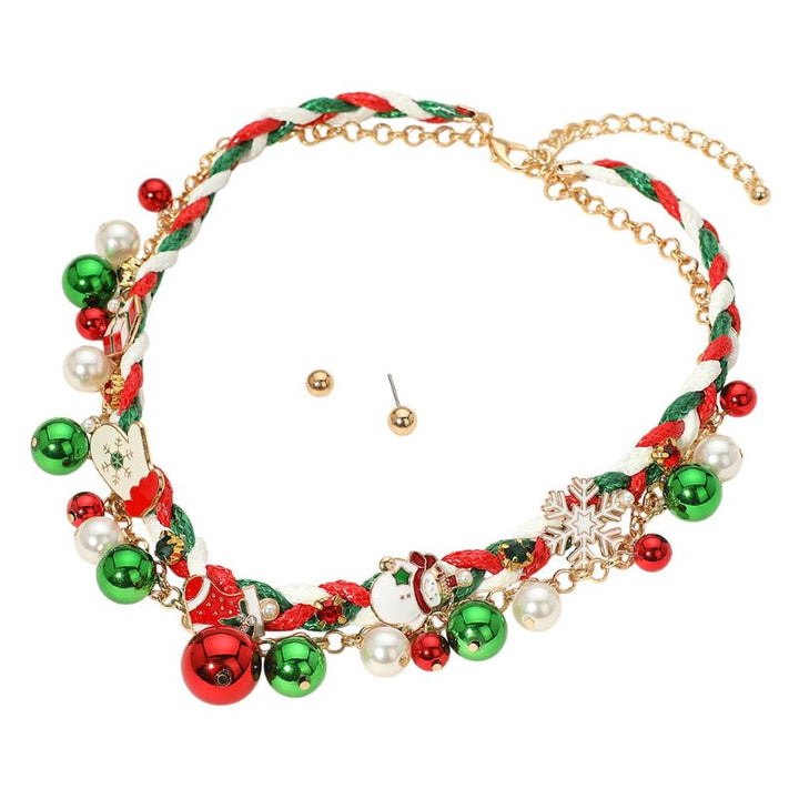 Festive and fun, this Christmas charm necklace set features braided red, green, and white cord with jingle bells, snowflakes, and holiday-themed charms. Includes matching gold stud earrings and an adjustable chain. Perfect for holiday parties, outfits, or gift giving.