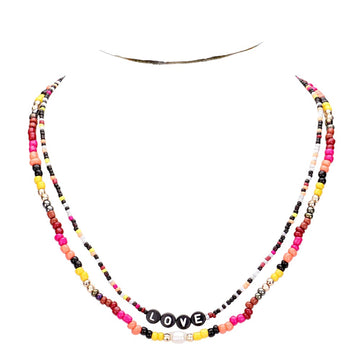 Gold Multi Color Bead Statement Love Layered Necklace adds a pop of color to any outfit! The multi-layered design and vibrant beads create a unique statement piece that is sure to catch attention. Elevate your style with this eye-catching necklace.