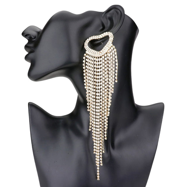 Gold Open Heart Accented Rhinestone Fringe Dangle Evening Earrings add elegance and sophistication to any outfit. The intricate design features a delicate open heart accent and sparkling rhinestone fringe, making them perfect for any occasion. Elevate your style with these glamorous earrings.