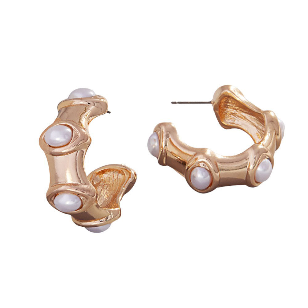 Oval Pearl Pointed Hoop Earrings, These elegant earrings add a touch of sophistication to any outfit. The unique design features delicate pearls and a pointed hoop shape, creating a timeless and classic look. Made with high-quality materials, these earrings are a perfect addition to any jewelry collection.