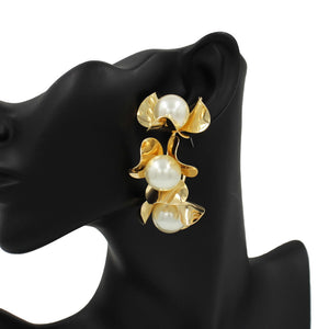 Gold These beautiful Pearl-accented Triple Metal Flower Hoop Earrings make a perfect addition to any formal attire. These earrings possess the timeless elegance of traditional jewelry with a modern touch. These hoop earrings are sure to be a favorite for any special occasion. Shine up yourself with these beautiful earrings.