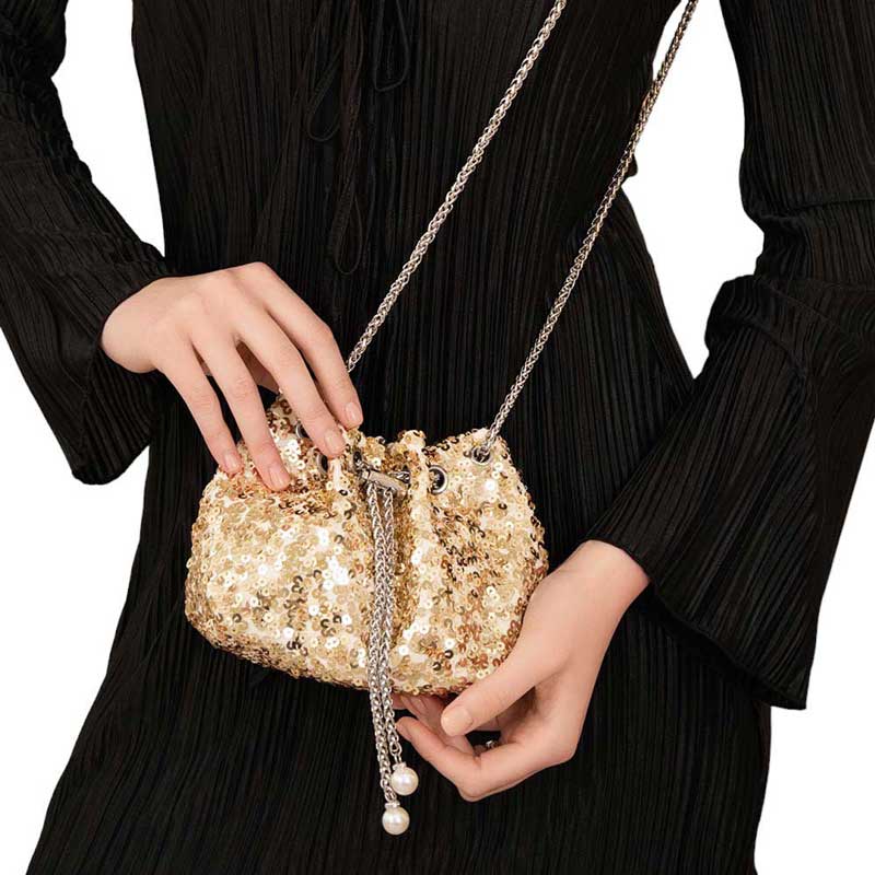 Black Add a touch of whimsy to your wardrobe with our Pearl Tip Chain Mini Sequin Crossbody Bag. Featuring a playful pearl-tipped chain and shimmering sequin detailing, this bag is both fun and fashionable. Perfect for any occasion, it's the perfect accessory to add some personality to your look.