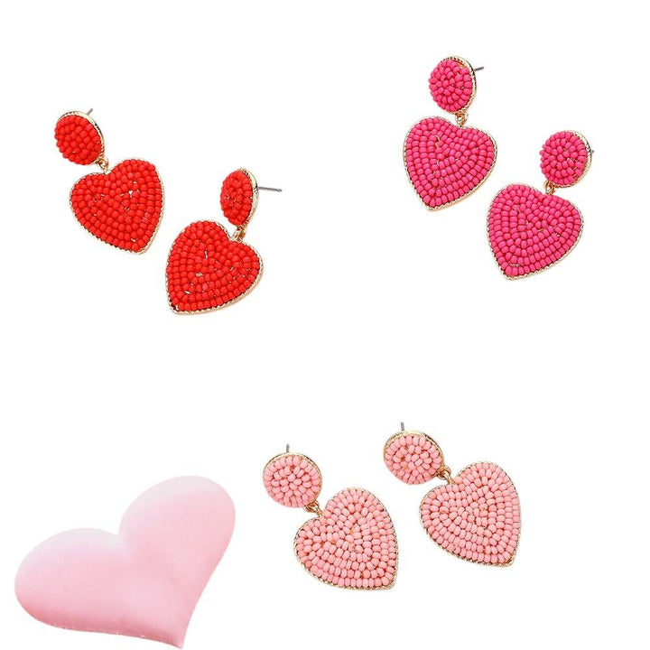 Gold-Red-Pink-Seed Beaded Heart Dangle Earrings are handcrafted with intricate seed beads, adding a delicate and stylish touch to any outfit. The heart-shaped design adds a touch of romance, making them a perfect gift for your loved one. Expertly crafted with quality materials, these earrings are durable and long-lasting. 