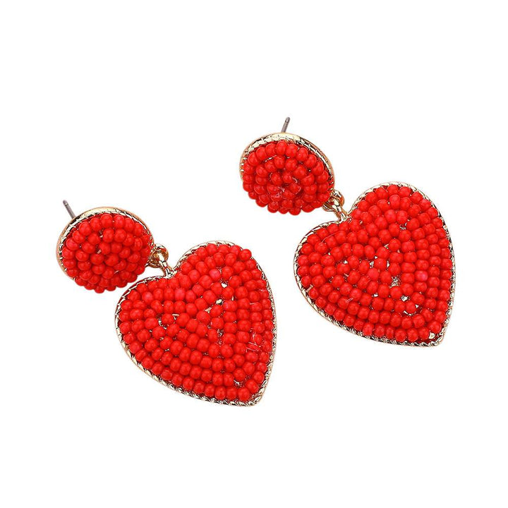 Gold-Red-Seed Beaded Heart Dangle Earrings are handcrafted with intricate seed beads, adding a delicate and stylish touch to any outfit. The heart-shaped design adds a touch of romance, making them a perfect gift for your loved one. Expertly crafted with quality materials, these earrings are durable and long-lasting. 