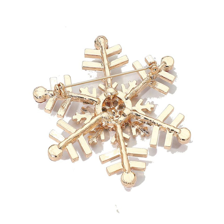 Elegant snowflake brooch adorned with shimmering crystals, perfect for adding a festive touch to coats, scarves, or winter outfits. A charming accessory that brings seasonal sparkle and refined style to any look.