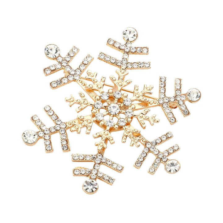 Elegant snowflake brooch adorned with shimmering crystals, perfect for adding a festive touch to coats, scarves, or winter outfits. A charming accessory that brings seasonal sparkle and refined style to any look.