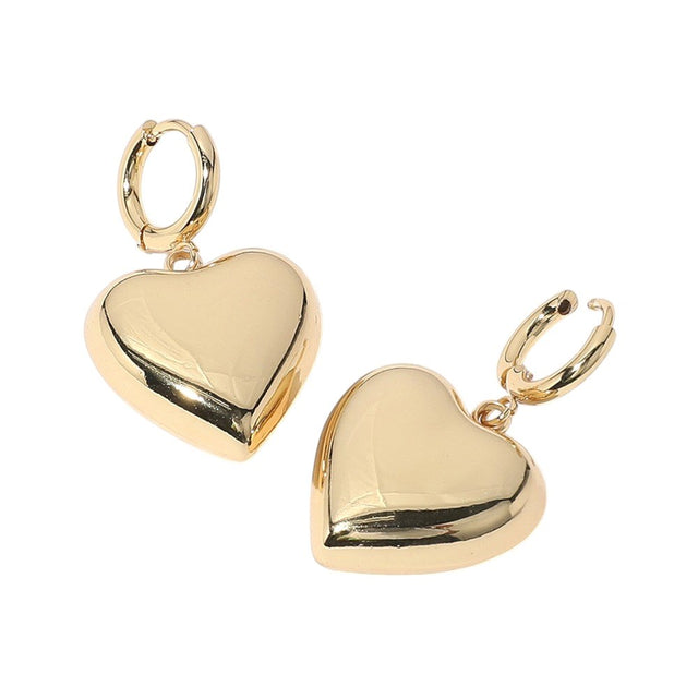Gold SECRET BOX Stainless Steel Heart Dangle Huggie Hoop Earrings are expertly crafted with high-quality stainless steel for durability and long-lasting wear. The elegant heart dangle adds a touch of romance, while the secure huggie hoop design ensures comfortable and easy wear. Elevate any outfit with these stylish and timeless earrings.