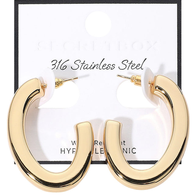 Gold SECRET BOX_Stainless Steel Oval Hoop Earrings are crafted from hypoallergenic stainless steel, making them a safe and comfortable option for everyday wear. Sleek and stylish, their oval shape will add a touch of elegance to any outfit. Expertly designed for long-lasting durability.