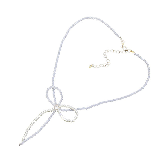 Gold SECRET BOX_Stone Pointed Faceted Beaded Bow Necklace is expertly crafted with precision and style. The pointed faceted beads create a unique and eye-catching design, while the delicate bow adds a touch of elegance. Perfect for adding a sophisticated touch to any outfit.