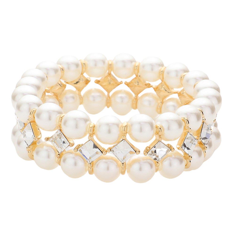 Gold Indulge in the effortless grace of our Square Stone Accented Pearl Stretch Bracelet. Adorned with square stones that delicately frame lustrous pearls, this bracelet exudes luxury and elegance. The stretch design allows for a comfortable and versatile fit. Elevate your style with this addition to your jewelry collection