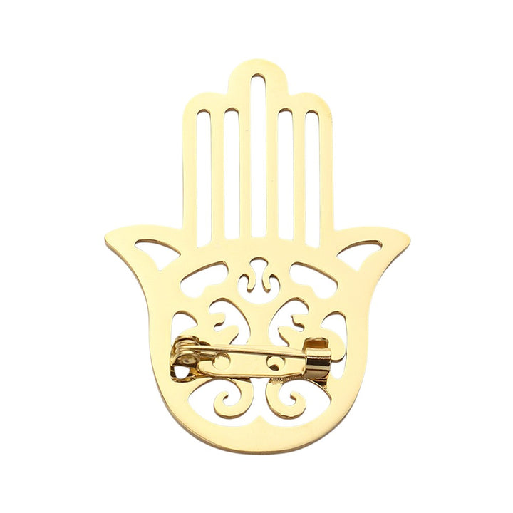 Gold &nbsp;Stainless Steel Cutout Hamsa Hand Pin Brooch is a beautiful and durable accessory, perfect for adding a touch of elegance to any outfit. Made of high-quality stainless steel, it features a delicate and intricate cutout design that showcases the symbolic Hamsa hand. With its superior material and craftsmanship, this brooch is sure to become a staple piece in your collection.