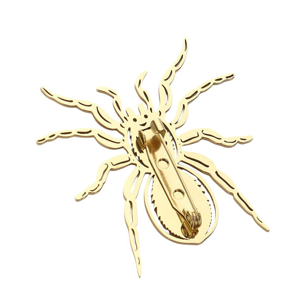 Gold Stainless steel cutout spider pin brooch is a sleek and stylish accessory that adds a touch of edginess to any outfit. Made from high-quality stainless steel, it is durable and long lasting, making it a great addition to your jewelry collection. With its unique design and expert craftsmanship, this pin brooch is sure to make a statement.