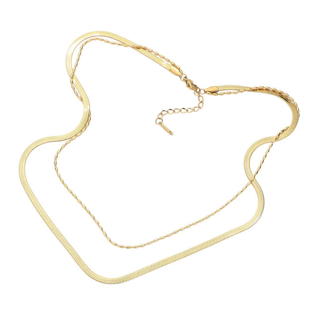 Gold Stainless Steel Herringbone Chain Layered Necklace offers a sleek and stylish addition to any outfit. Crafted from high-quality stainless steel, this necklace is durable and resistant to tarnishing. Its herringbone chain design adds a unique touch, making it a versatile piece for any occasion. Elevate your look with this modern and sophisticated accessory.