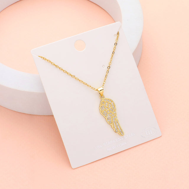 Gold Stainless Steel Stone Paved Wing Pendant Necklace is a unique and stylish piece of jewelry that is perfect for any occasion. Made with high-quality stainless steel, it is durable and resistant to tarnishing. The intricate pave design adds a touch of elegance, making it a perfect addition to any outfit. Elevate your style with this eye-catching necklace.