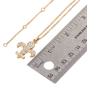 Gold Stone Paved Fleur de Lis Pendant Necklace, is expertly crafted with stunning detail and precision. The intricate fleur de lis design is adorned with shimmering stones, making it a beautiful and elegant accessory for any occasion. Its eye-catching design makes this necklace a must-have addition to any jewelry collection