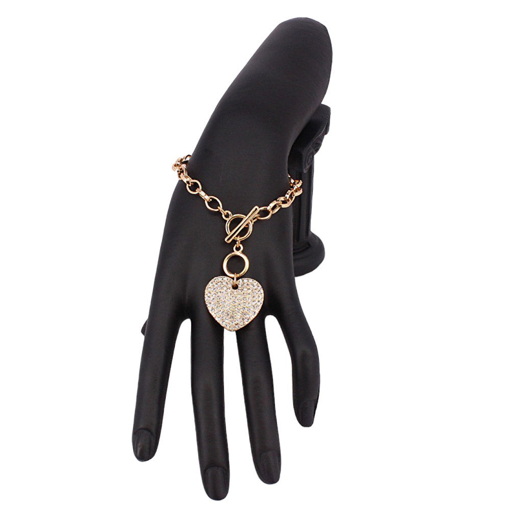 Gold Stone Paved Heart Pendant Metal Toggle Bracelet, is a must-have accessory for any fashion-forward individual. Exquisitely crafted to elevate any outfit, this bracelet is a unique addition to your jewelry collection. Its toggle closure ensures a secure fit and its elegant style will make you stand out from the crowd.