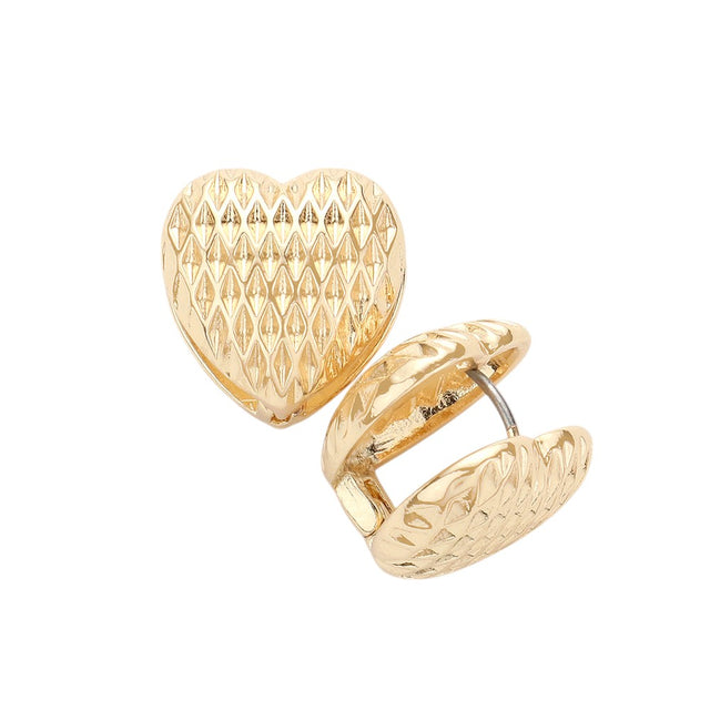 Gold Textured Heart Metal Huggie Earrings are a must-have for any jewelry collection. Crafted from high-quality metal, they feature a unique textured design that adds depth and dimension to any outfit. With their huggie style, these earrings sit comfortably and securely on the earlobe. A perfect blend of style and functionality for any occasion.