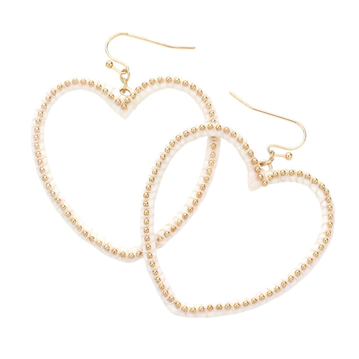 Gold White Raffia Metal Ball Wrapped Open Heart Dangle Earrings add a touch of sophistication to any outfit. The delicate raffia wrapping and open heart design make them a unique and stylish accessory. Handcrafted with precision, these earrings are a must-have for any fashion-forward individual.