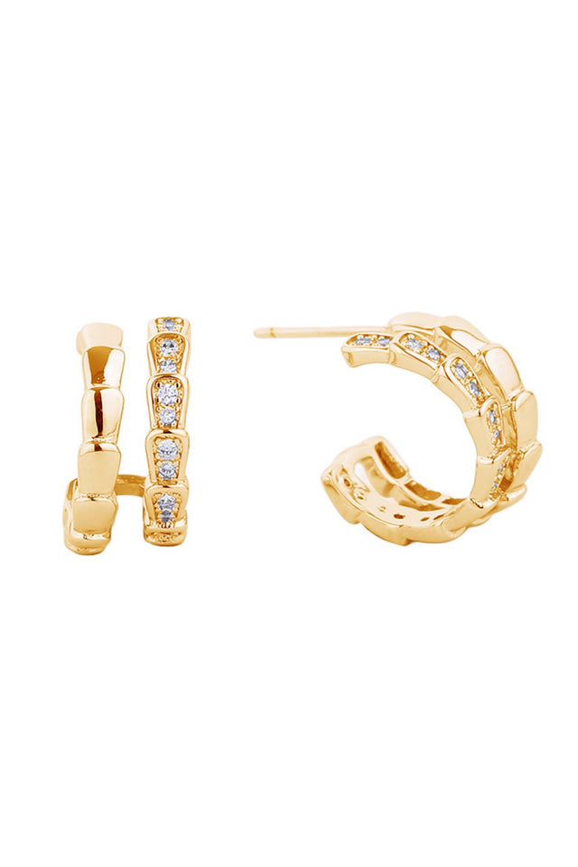 Gold Elegant post hoop earrings featuring a lustrous 14K gold and white dip finish. Each piece is adorned with cubic zirconia pavé detailing for a sparkling, sophisticated look. Crafted from hypoallergenic brass, these earrings are gentle on sensitive skin. With a delicate 1.52cm diameter, they offer the perfect balance of presence and wearability. Lead and nickel compliant for safe, worry-free wear.