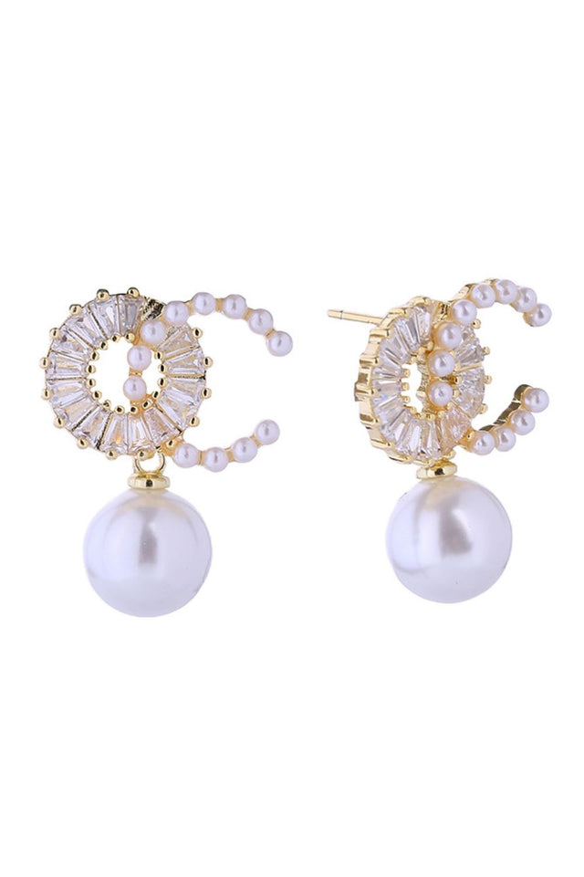 Gold Elegant pearl drop earrings crafted with 14K gold and white gold dipping for a luxurious finish. Featuring lustrous O-C pearls paired with sparkling cubic zirconia accents, these hypoallergenic posts are gentle on sensitive ears. Measuring 2cm, they offer the perfect balance of sophistication and wearability. 