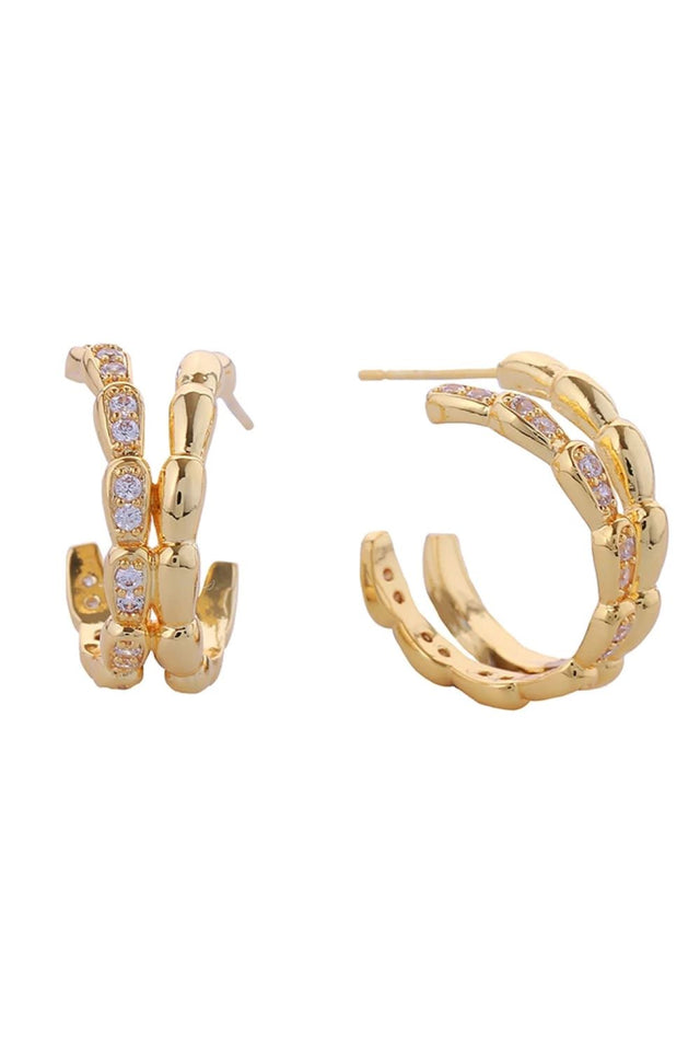 Gold Elevate your everyday elegance with these stunning 14K Gold/White Dipped Serpenti Pave CZ Post Earrings. Crafted from quality brass and adorned with sparkling cubic zirconia pavé detailing, these 2cm diameter studs deliver timeless sophistication with a modern edge. Designed for comfort and safety, these hypoallergenic earrings are lead and nickel compliant, making them perfect for sensitive skin. The secure post backing ensures they stay in place throughout your day, whether you're heading to the offi