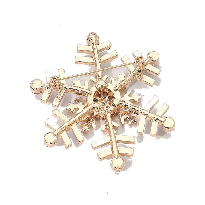 Elegant snowflake brooch adorned with shimmering crystals, perfect for adding a festive touch to coats, scarves, or winter outfits. A charming accessory that brings seasonal sparkle and refined style to any look.