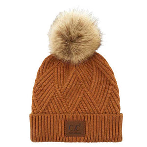 Golden Camel C.C Heather Beanie Hat With Pom Pom And Suede Patch, provides excellent protection and a fashionable look with its soft heather knit material, faux fur pom pom, and stylish suede patch. The fabric is designed to keep you comfortably warm in cold weather. Add this fashionable accessory to the winter wardrobe collection.