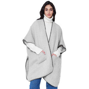 Gray Blanket Stitch Front Pockets Kimono Poncho, is designed with a stylish blanket stitch detail and two front pockets for added convenience. The poncho is made from soft, breathable fabric and is perfect for everyday wear this winter. Ideal gift for friends and family on chilly winter days. 