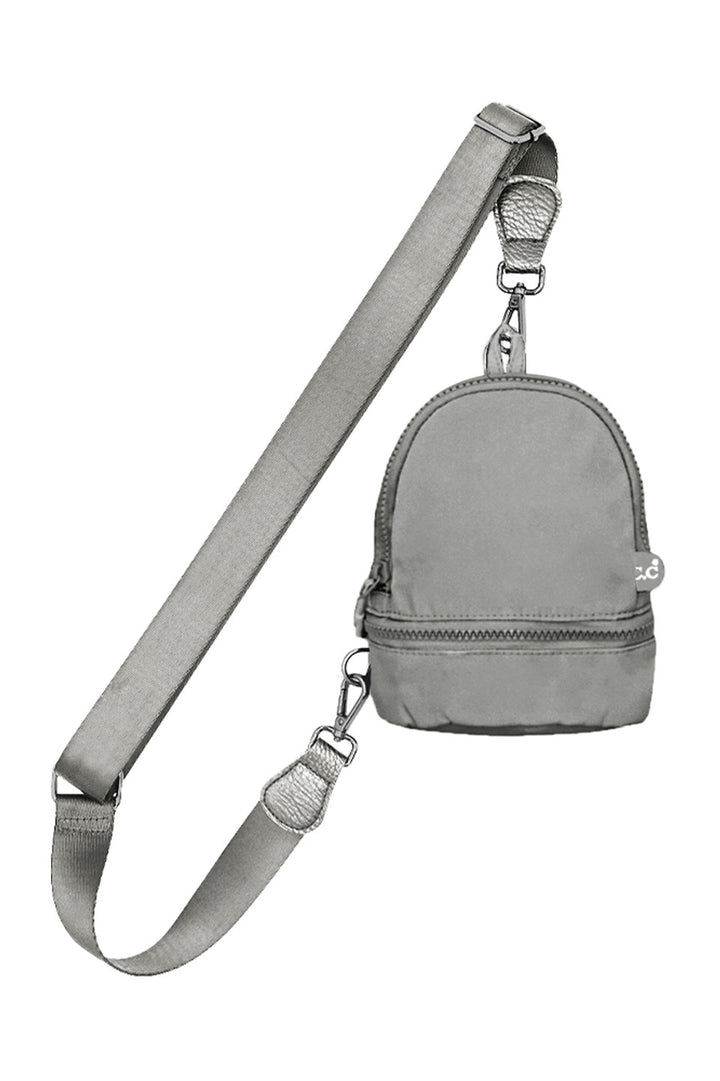 Gray C.C Mini Solid Sling Backpack offers a compact yet functional design, perfect for hands-free convenience. Crafted with durable materials, it ensures long-lasting use while providing secure storage for essentials. Its adjustable strap allows for a comfortable fit, making it ideal for daily errands or travel. This sleek backpack combines practicality with style, delivering expert-level utility in a minimalist package. 
