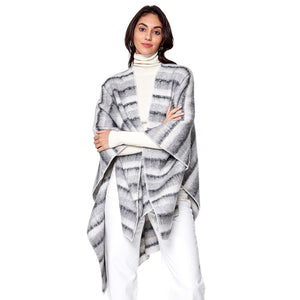Gray Cozy Striped Three Tone Ruana Poncho, is made with a blend of soft, durable materials for maximum warmth and comfort. The unique three-tone striped pattern is both fashionable and eye-catching. A thoughtful gift for fashion-loving friends and family members, special ones, and colleagues this winter.