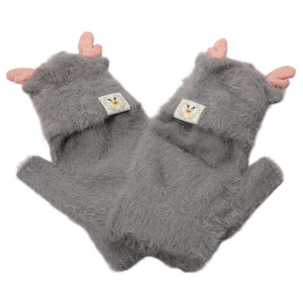 Add a playful touch to your winter style with these soft fuzzy gloves featuring adorable reindeer ear accents and a charming stitched detail. Warm, cozy, and fun, they make the perfect cold-weather essential for outdoor wear or a delightful holiday gift.