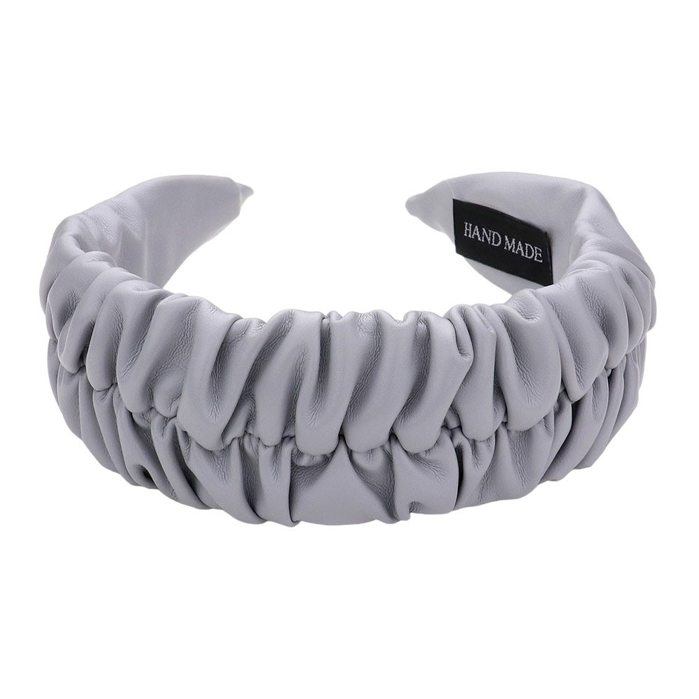Gray Pleated Solid Faux Leather Headband, This stylish accessory adds an elegant touch to any outfit. Made with high-quality materials, it is both comfortable and durable. The pleated design offers a unique, sophisticated look, while the faux leather adds a touch of luxury. Perfect for any formal or casual occasion wear.