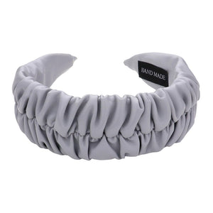 Gray Pleated Solid Faux Leather Headband, This stylish accessory adds an elegant touch to any outfit. Made with high-quality materials, it is both comfortable and durable. The pleated design offers a unique, sophisticated look, while the faux leather adds a touch of luxury. Perfect for any formal or casual occasion wear.