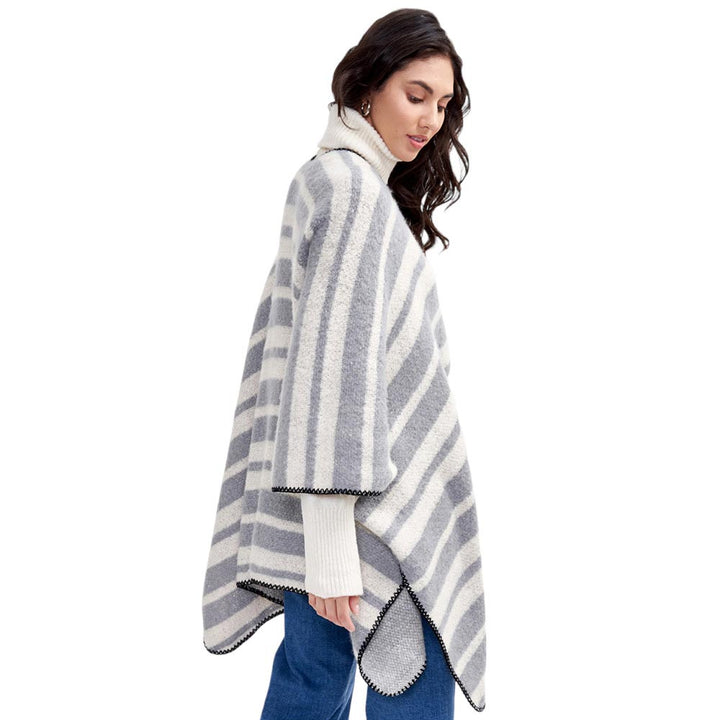 Gray Striped Cozy Two Tone Knit Kimono Poncho, is crafted from a soft blend of quality materials for a comfortable, stylish look. The two-tone knit pattern ensures a unique, eye-catching piece. A thoughtful gift for fashion-loving friends and family members, special ones, and colleagues, this winter.