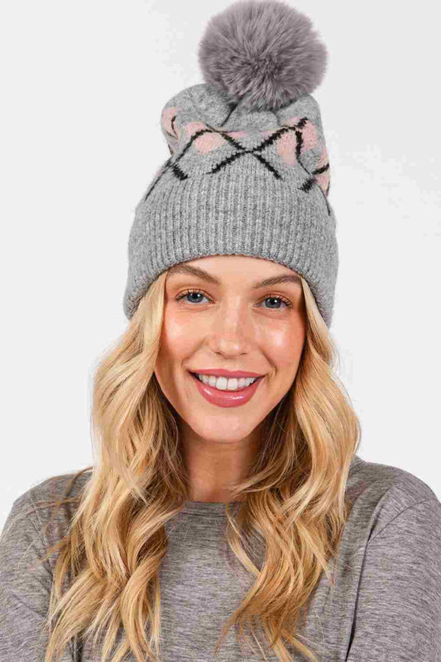Gray Wool Blended Argyle Fleece Pom Pom Beanie features a classic argyle pattern with cozy fleece lining and a soft wool-blend knit for extra warmth and style. Finished with a fluffy pom and comfortable stretch fit, it keeps you snug while adding timeless charm to your winter outfits.