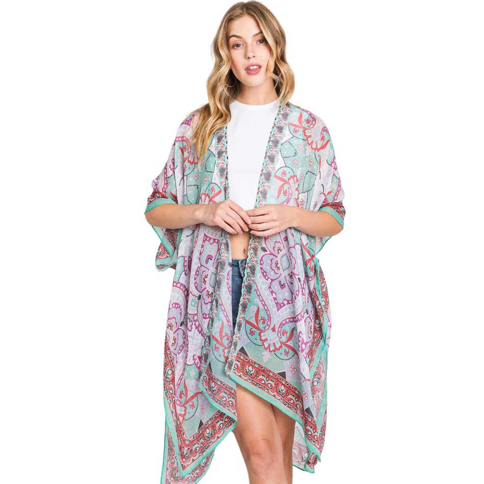 Green Abstract Paisley Print Kimono Poncho, Expertly crafted with an abstract paisley print, this kimono poncho is a versatile addition to any wardrobe. Made with lightweight, breathable material, it's perfect for layering over any outfit for a chic look. Enjoy the unique design and comfortable fit of this statement piece.
