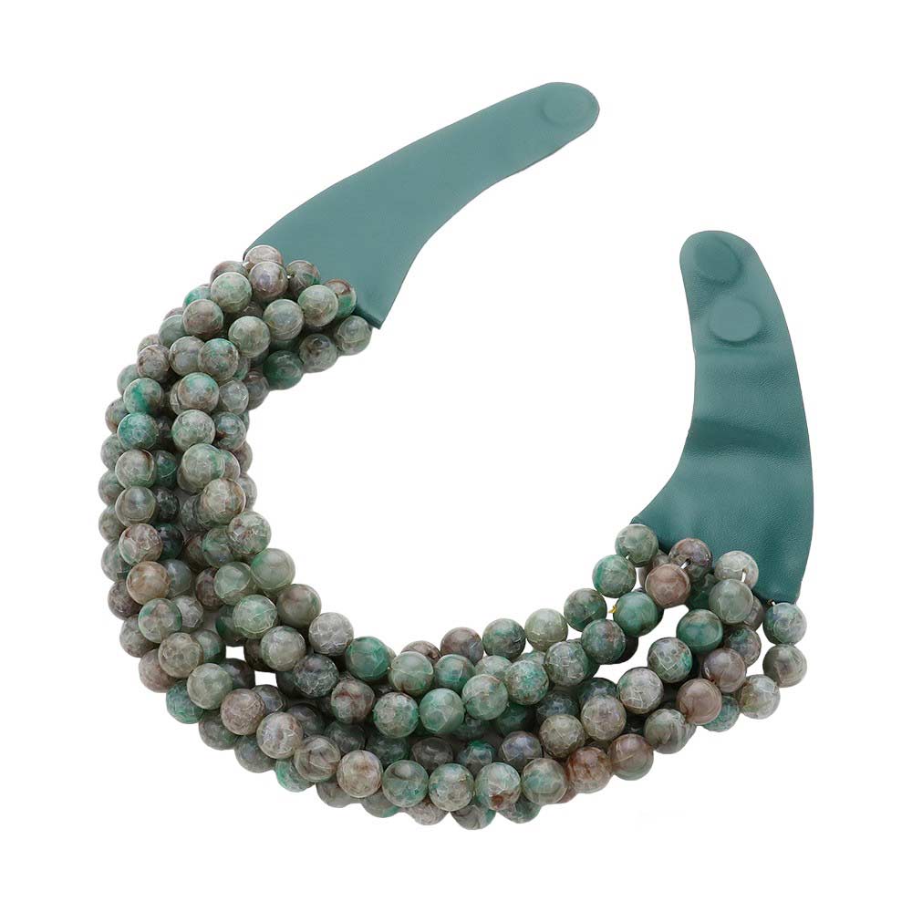 Green Chunky Metal Ball Beaded Multi Layered Faux Leather Magnetic Necklace, Add a bold touch to your wardrobe with this necklace. Featuring multiple strands of soft faux leather adorned with chunky metal ball beads, this statement necklace effortlessly elevates any outfit. The magnetic clasp ensures easy wear.