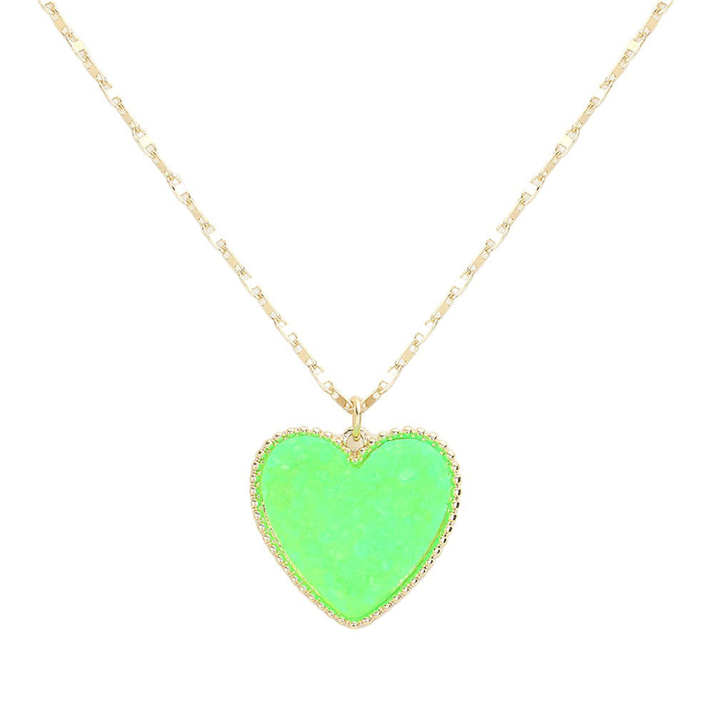 Green Druzy Heart Pendant Necklace, this is a stunning accessory that adds a touch of sparkle to any outfit. The druzy heart pendant is beautifully crafted and catches the light for a mesmerizing effect. With its unique design and high-quality materials, this necklace is sure to make a statement and elevate your look.