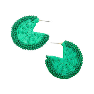 Green Raffia Wrapped Seed Beaded Round Earrings, Expertly crafted with a combination of raffia and seed beads, these round earrings add a touch of natural elegance to any outfit. The intricate beadwork and unique wrapping technique showcase expert artistry. Elevate your style with these earrings, perfect for any occasion.