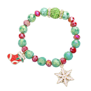 Green Rudolph Christmas Tree Charm Faceted Beaded Stretch Bracelet. Adorn your wrist this holiday season with these bracelets. Bring a festive touch to your wardrobe this season. Awesome gift item for every young adult, sister, daughter, bestie, wife or partner, friend and family member.