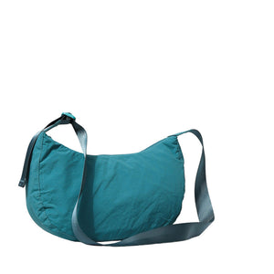 Green Solid Nylon Sling Bag Crossbody Bag, is perfect to carry all your handy items with ease. This handbag features a top zipper closure for security that makes your life easier and trendier. This is the perfect gift idea for a birthday, holiday, Christmas, anniversary, Valentine's Day, etc.
