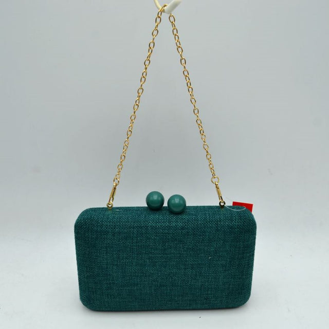 Green This elegant box clutch bag features a textured woven finish & a structured rectangular silhouette w/ rounded corners, making it ideal for special occasions or everyday styling. The secure top opening is fastened w/ an eye-catching double bead clasp mechanism, ensuring your daily essentials are safely tucked away. Equipped w/ a delicate, metallic chain-link shoulder strap that attaches to integrated rings, this evening-ready accessory offers a classic look & convenient hands-free carrying options.