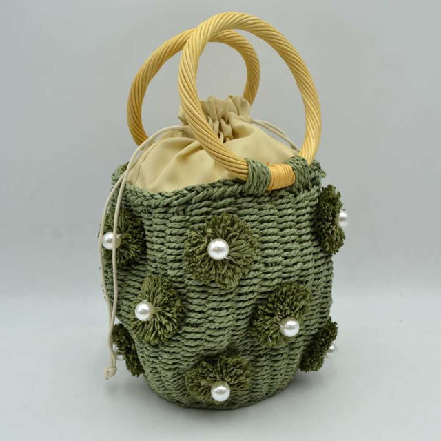 Green Infuse your daily style with a touch of resort-inspired luxury. This sophisticated bucket-style shoulder bag perfectly blends the airy feel of a woven summer tote with the structured polish of premium black accents, making it an incredibly versatile accessory for work, travel, or weekend getaways.