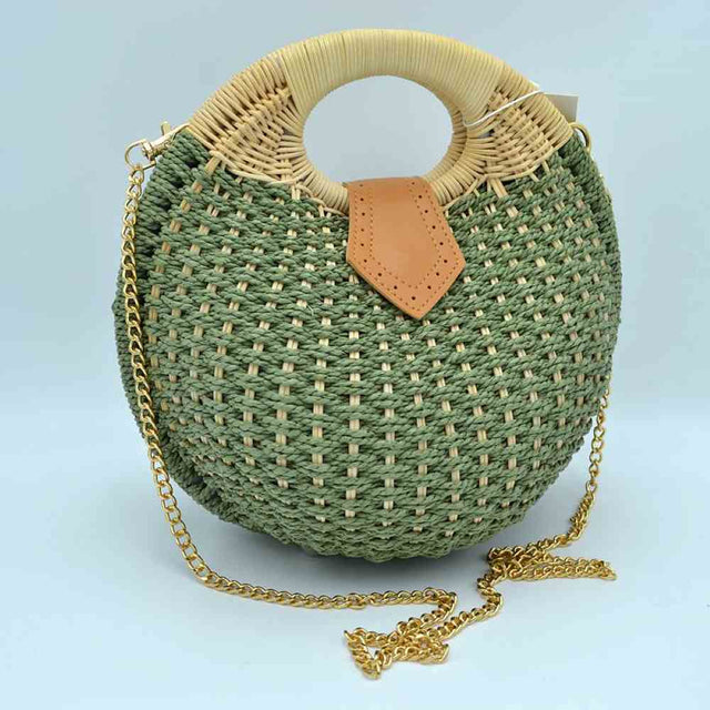 Green Make a vibrant, sun-kissed statement with this beautifully structured round straw handbag. Combining a striking geometric silhouette with organic textures, this bag is a cheerful, high-fashion addition to your vacation wardrobe, picnic dates, or warm-weather strolls.