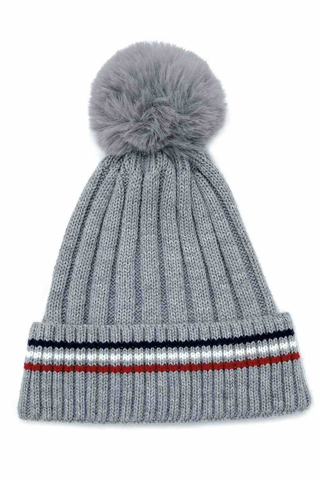 Grey Add a cozy-chic touch to your winter wardrobe with this Stripe Rib Super Soft Cuff Beanie, designed for warmth and everyday comfort. Finished with a luxurious faux fur pom, it delivers a stylish look while keeping you snug on colder days.