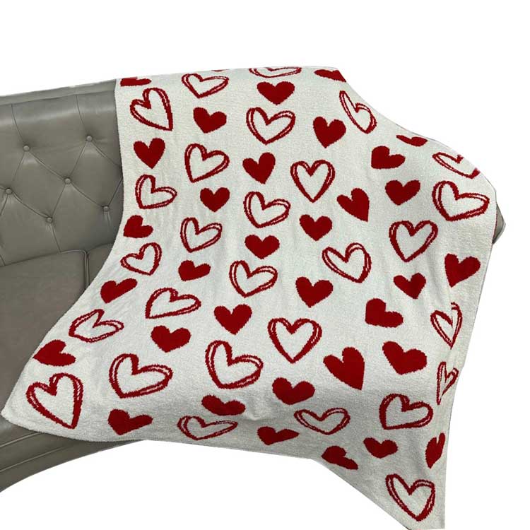 Heart Patterned Reversible Throw Blanket, This reversible throw blanket features a charming heart pattern that adds a touch of warmth to any room. Made with soft, high-quality material, this blanket is perfect for cozying up on chilly nights. It can easily switch up your decor and add a pop of color to your space.