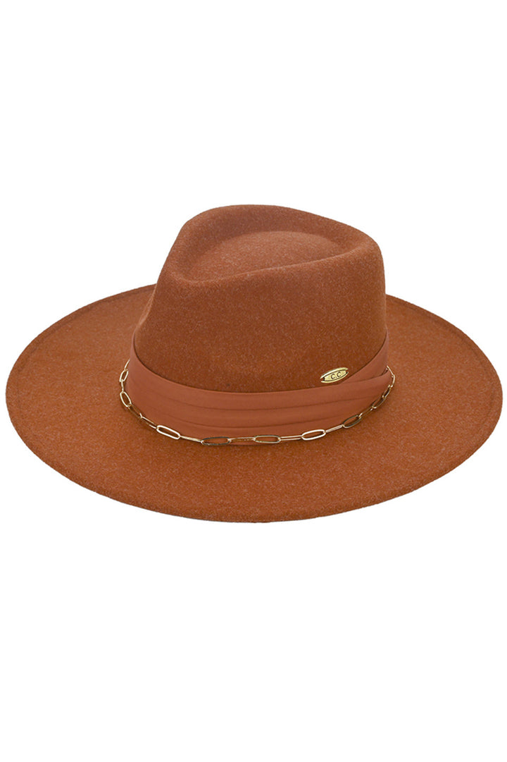 HeatherRust C.C Link Chain & Pleated Wide Band Vegan Felt Hat is expertly crafted with a unique link chain design and a pleated wide band. Made with vegan felt, it offers a sophisticated and eco-friendly alternative to traditional hats. Elevate your style with this fashionable and sustainable accessory.