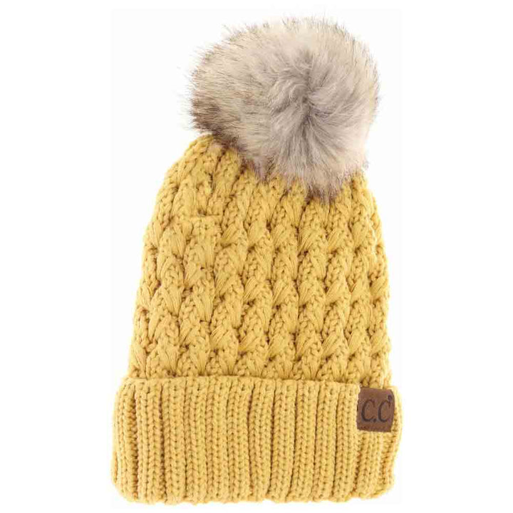 HoneyMustard Solid Lattice Stitch Fur Pom CC Beanie features a meticulously crafted lattice stitch design that ensures exceptional warmth and durability. Topped with a soft, luxurious fur pom, this beanie combines functional insulation with sophisticated style. Its versatile solid color and expert construction make it an essential accessory for cold-weather protection while elevating your winter wardrobe.