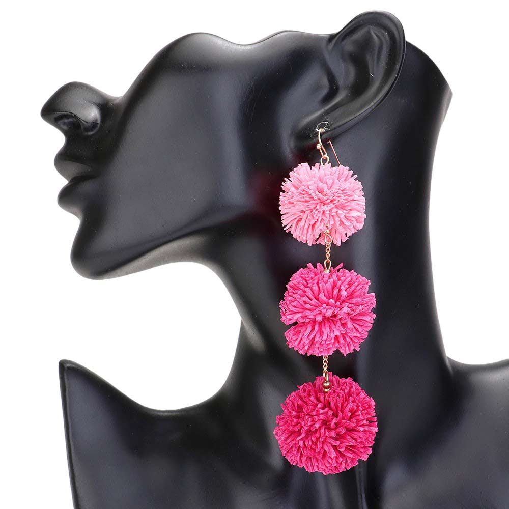 Hot Pink Raffia Pom Pom Link Dropdown Earrings, These unique earrings combine the natural texture of raffia with playful pom poms to add a touch of whimsy to any outfit. The link design gives them a modern, chic feel while the dropdown style elongates the neck. Elevate your style with these statement earrings.