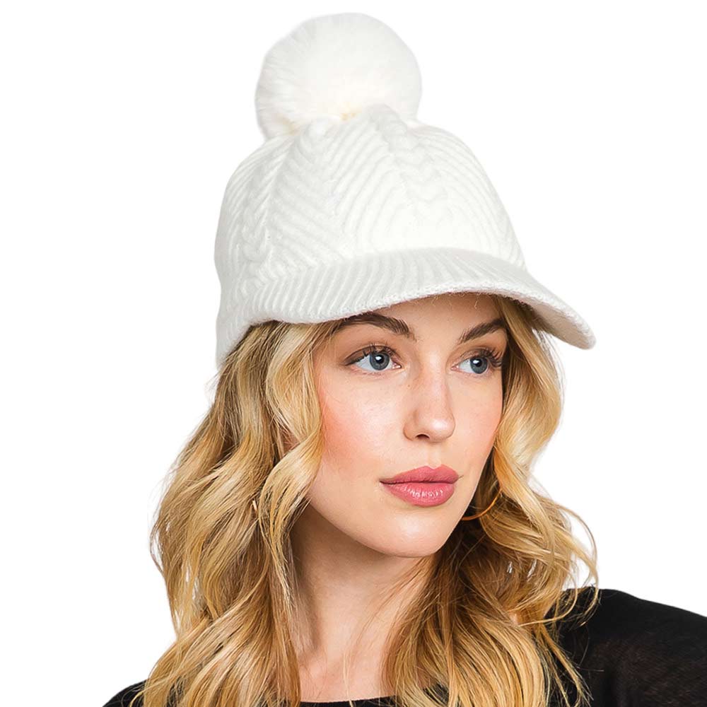 Ivory Chevron Patterned Faux Fur Pom Pom Knit Cap will keep you warm and stylish in winter weather. Its faux fur pom pom and chevron patterned knit detail makes this cap the perfect mix of luxury and comfort. Wear it confidently and stay warm on cold days. Excellent gift choice for family members and friends on chilly days.